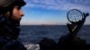 Украинский патрульный катер в Черном море, вдалеке – гражданское грузовое судно. Февраль 2024 года