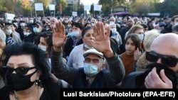 Armenians take part in a protest against the Moscow-brokered peace deal with Azerbaijan on November 13, 2020 in Yerevan's Freedom Square.