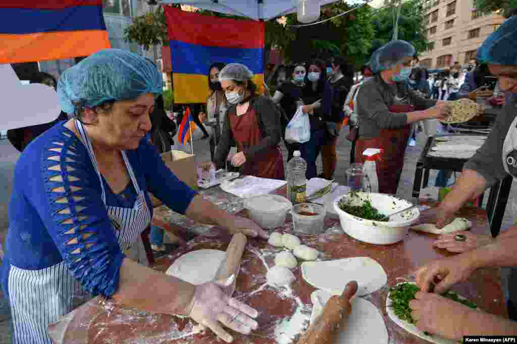 In Yerevan, refugees from Nagorno-Karabakh sell herb-stuffed flatbreads, a regional specialty, to raise money to send back home. The number of Karabakhi refugees now in Armenia remains unclear. 