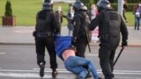 BELARUS -- Belarusian law enforcement members detain a man during an opposition protest following the inauguration of Belarusian President Lukashenka in Minsk, September 23, 2020
