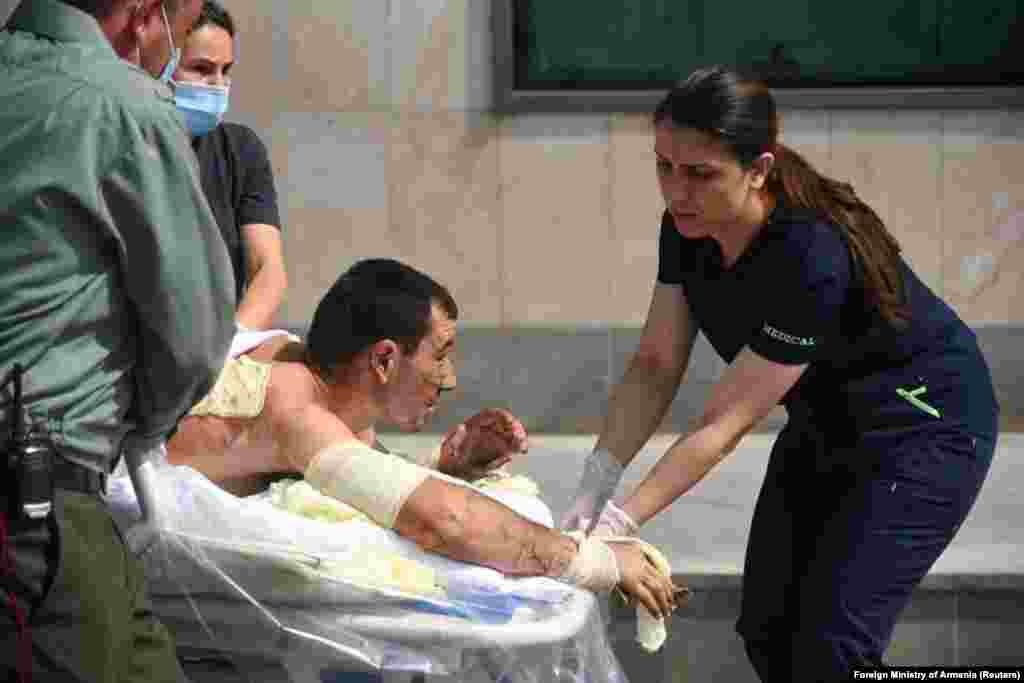 The Armenian Foreign Ministry published this photo in which medical workers assist a man said to be a citizen injured in the fighting with Azerbaijani forces.