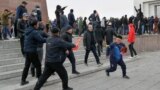  Demonstrators from rival political groups react during a rally in Bishkek on October 9, 2020.