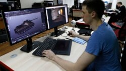 A programmer for Game Stream, a branch of video game company Wargaming, at work in Minsk in 2016.