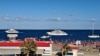 Yachts and boats are docked in the marina while the beach is closed due to bad weather conditions at the Egyptian Red Sea resort of Hurghada after a tourist boat sank off Red Sea coast