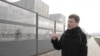 Current Time correspondent Timofei Rozhansky walks outside a new medical center in Moscow's Kommunarka district that was opened early to treat coronavirus patients. 