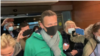 Russian opposition activist Aleksei Navalny, with his wife, Yulia (left front), enters Moscow's Sheremetyevo airport on January 17, 2021 after a flight from Berlin. 