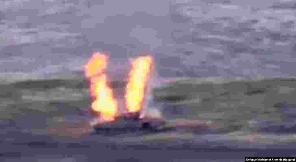 A frame from a video clip published by the Armenian Defense Ministry reportedly shows an Azerbaijani armored personnel carrier destroyed by Armenian armed forces.