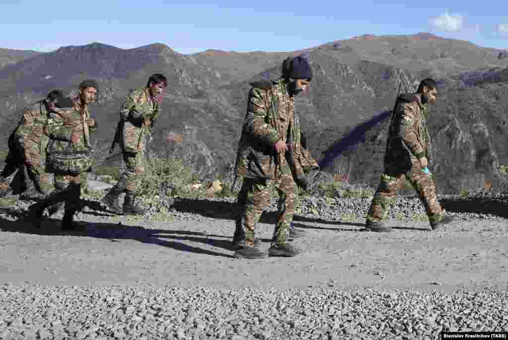 Unidentified servicemen head toward Armenia on November 8, 2020, the day Azerbaijani President Ilham Aliyev announced that Azerbaijani forces had retaken control of Shusha (Shushi in Armenian). Although Armenian President Nikol Pashinian maintains that fighting continues there, Karabakh's de facto government has conceded that it has lost control of the town. 