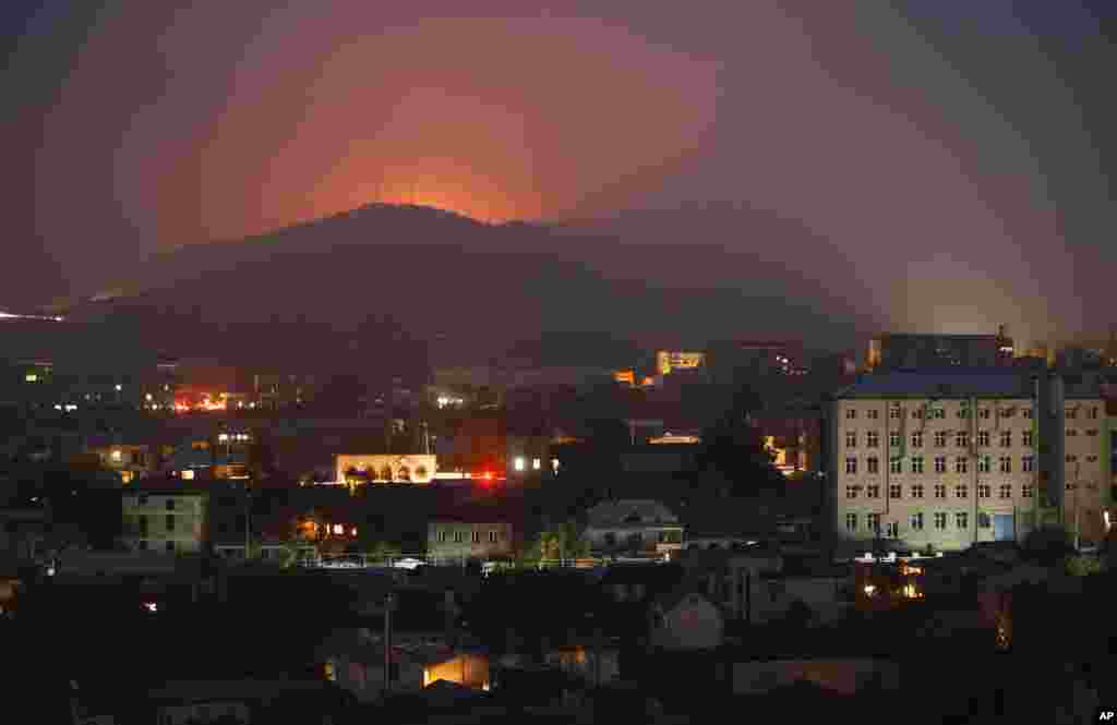 Bursts of explosions are seen on November 5, 2020 during fighting between Armenian-Karabakhi and Azerbaijani forces near Shushi (Shusha), a strategic hilltop town about a half-hour's drive from Karabakh's main town, Stepanakert (Khankendi). 