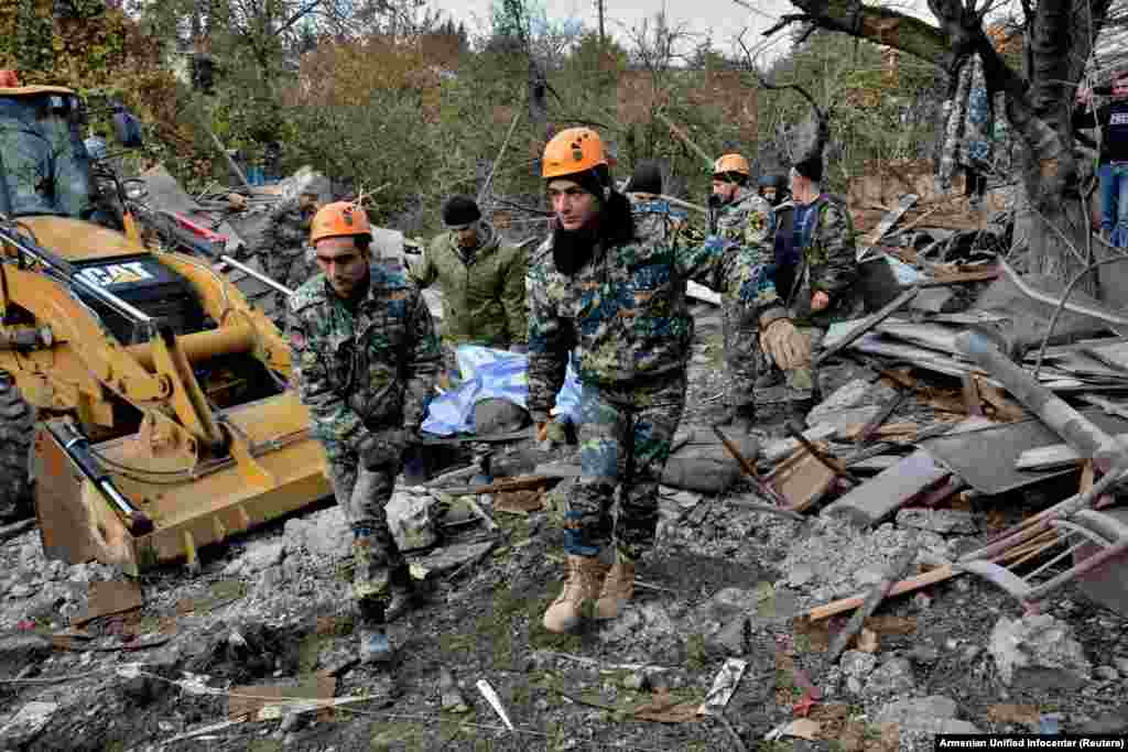NAGORNO-KARABAKH -- Rescuers carry the body of a victim following what is said to be recent shelling in the city of Stepanakert during a military conflict over the breakaway region of Nagorno-Karabakh, November 6, 2020